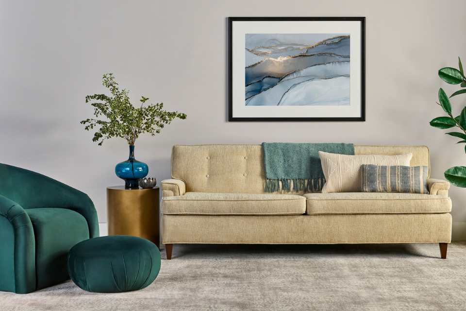 plush grey patterned carpet in living room with green velvet accents